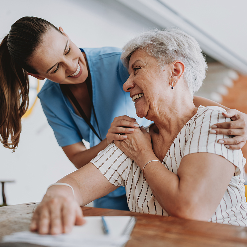 Nurse laughing with patient