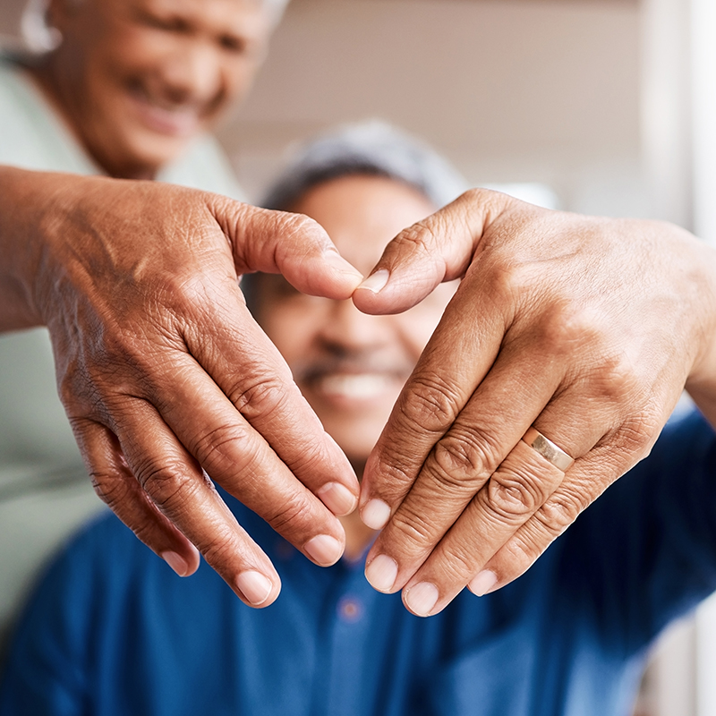 Close up of hands shaping heart